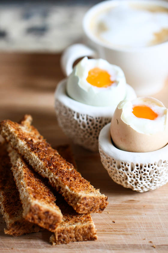close up photo of soft boiled eggs and toast